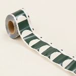 Unwound rollstock film shows evenly repeated abstract printing and small rectangular registration marks along one edge.